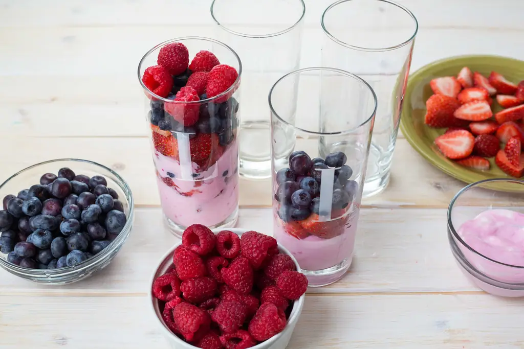 Yoghurt layered with berries in glasses
