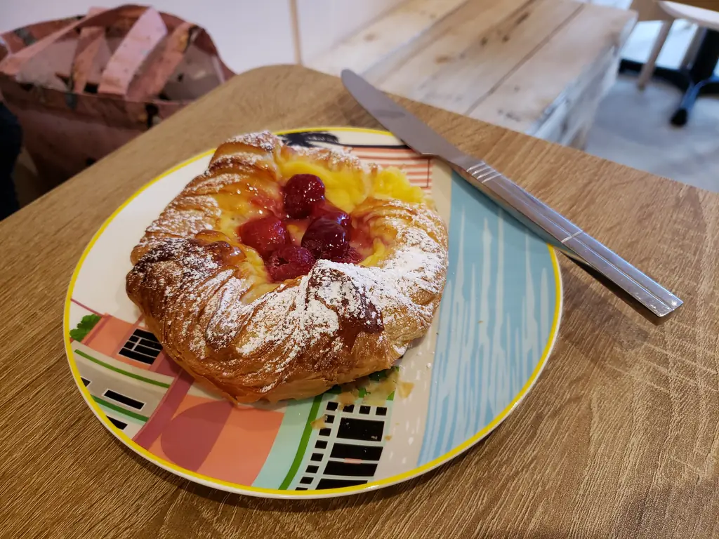 Fruit-topped pastry on a plate