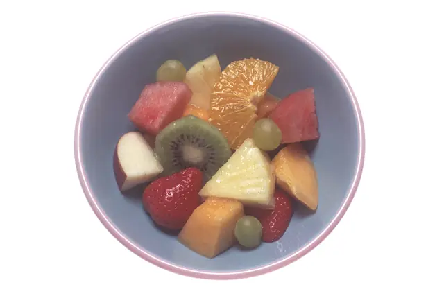 A bowl of cut fresh fruit