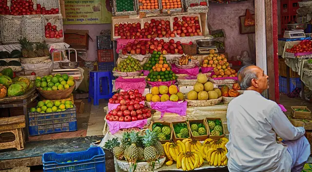 Fruit shop in India with stacked fresh fruit