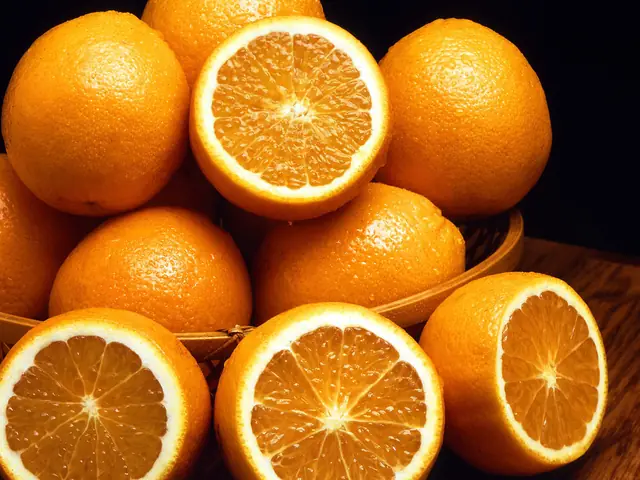 Whole and halved oranges