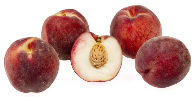 Whole and halved peaches